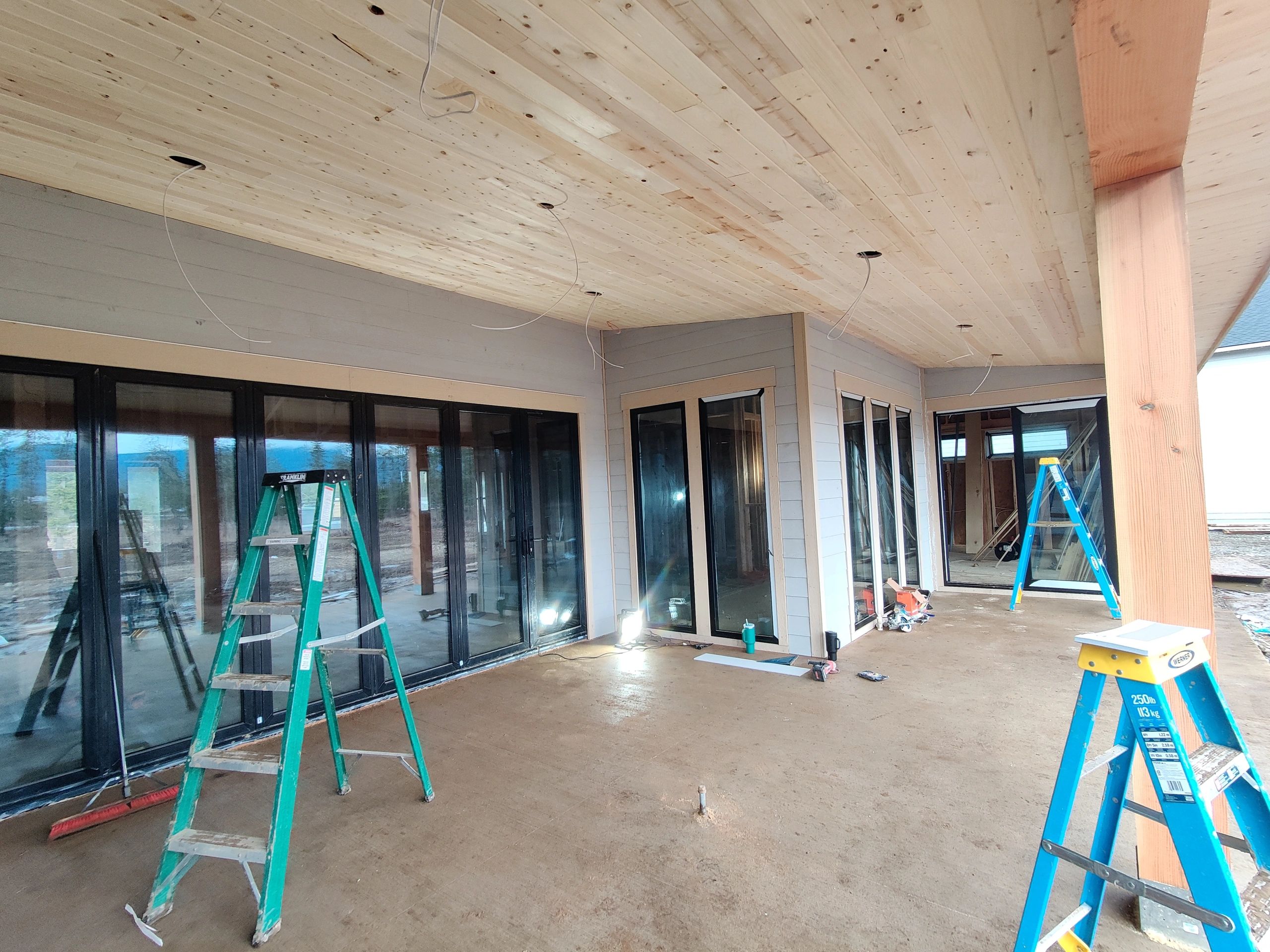 Covered patio project showing finish carpentry progress around the outdoor living area