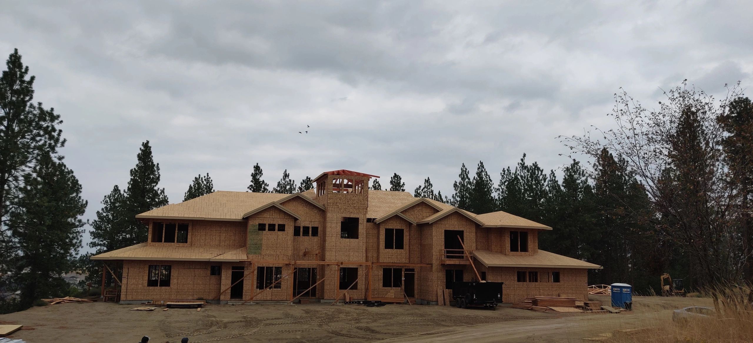 Woodland custom home framing from a second exterior angle